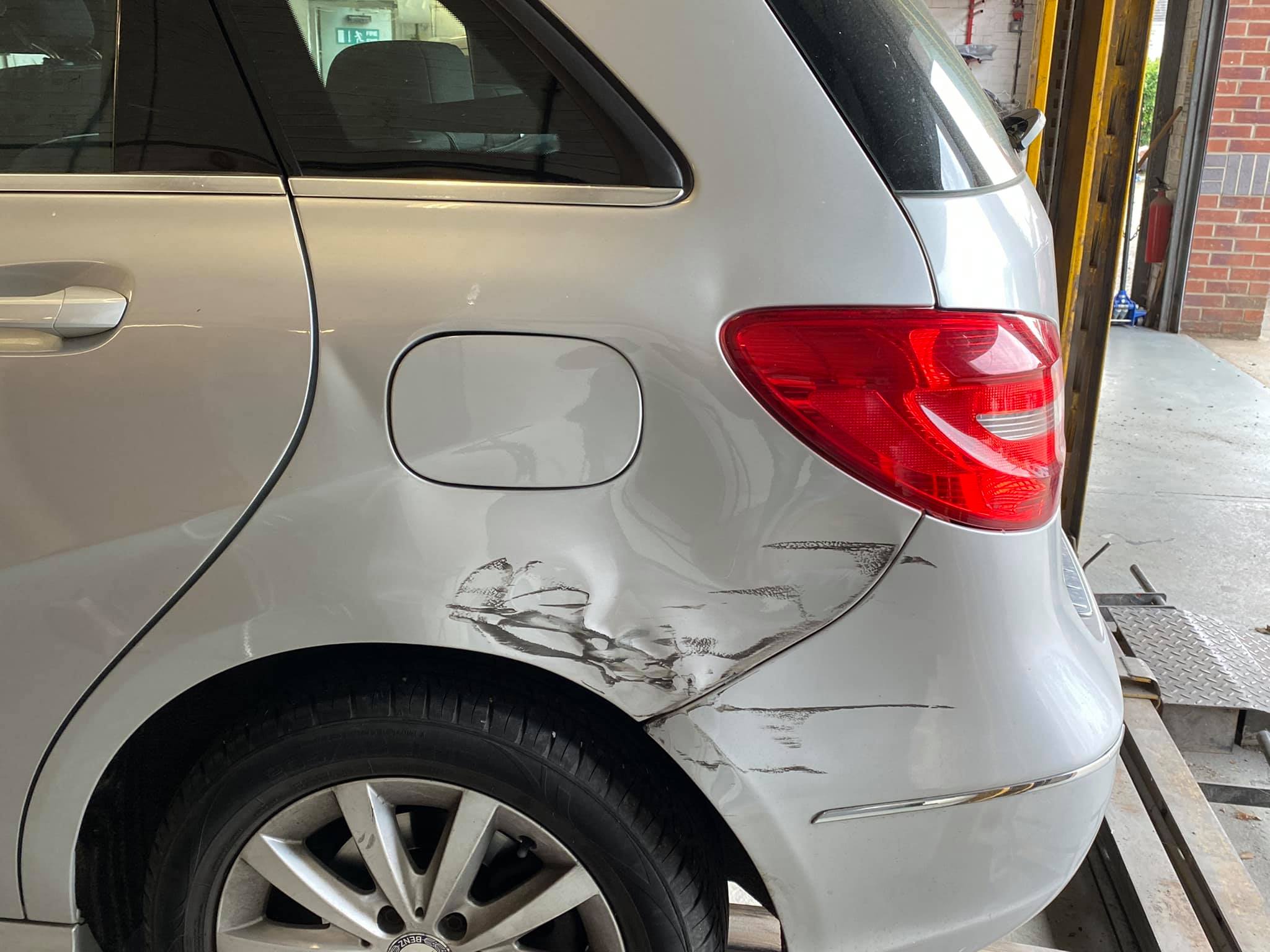 damaged rear of silver car